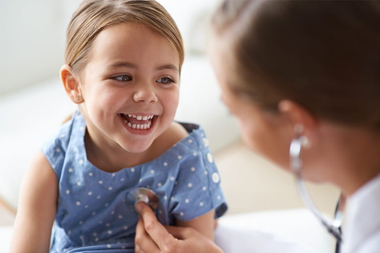  young girl with her pediatrician