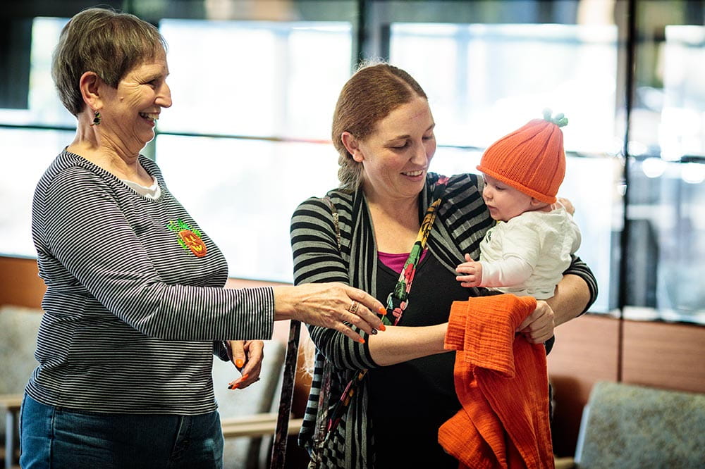 A baby with his Mom and Grandmother