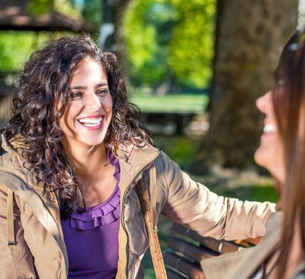 Woman laughing with her friends