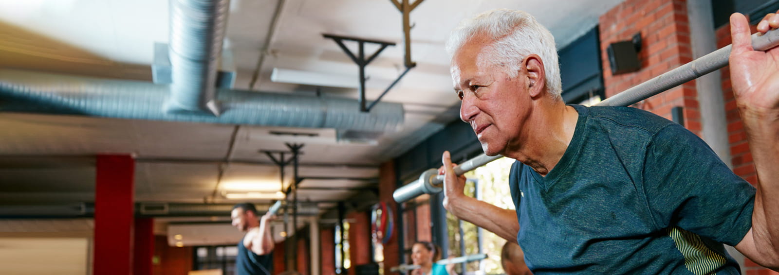 Man with prostate cancer working out at a gym
