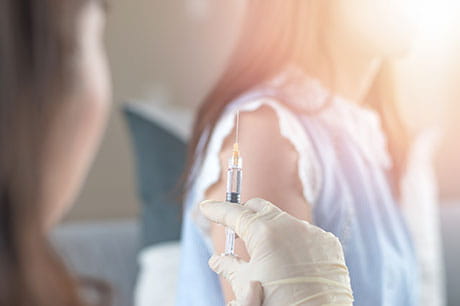 girl getting a vaccine