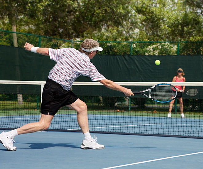 Couple playing tennis