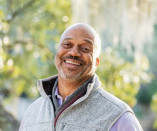 man smiling in the park