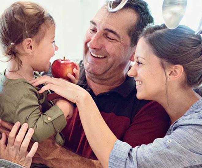 family doting over daughter