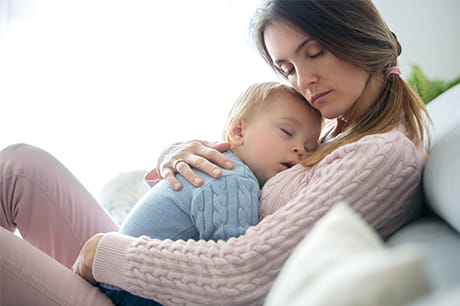 mother holding child on he chest