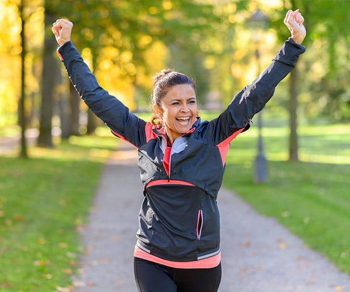 A senior woman working out in the city