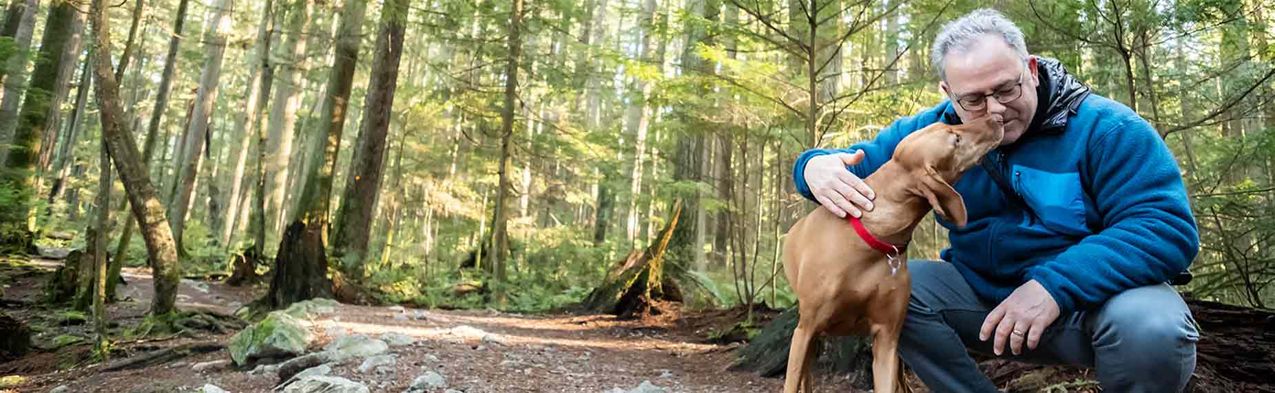 Man hiking with dog