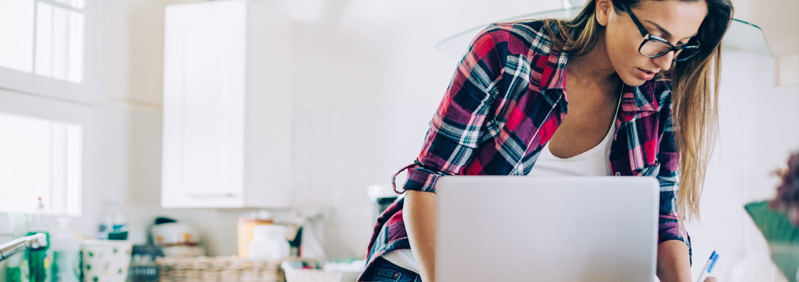 Female looking down in a pink flannel