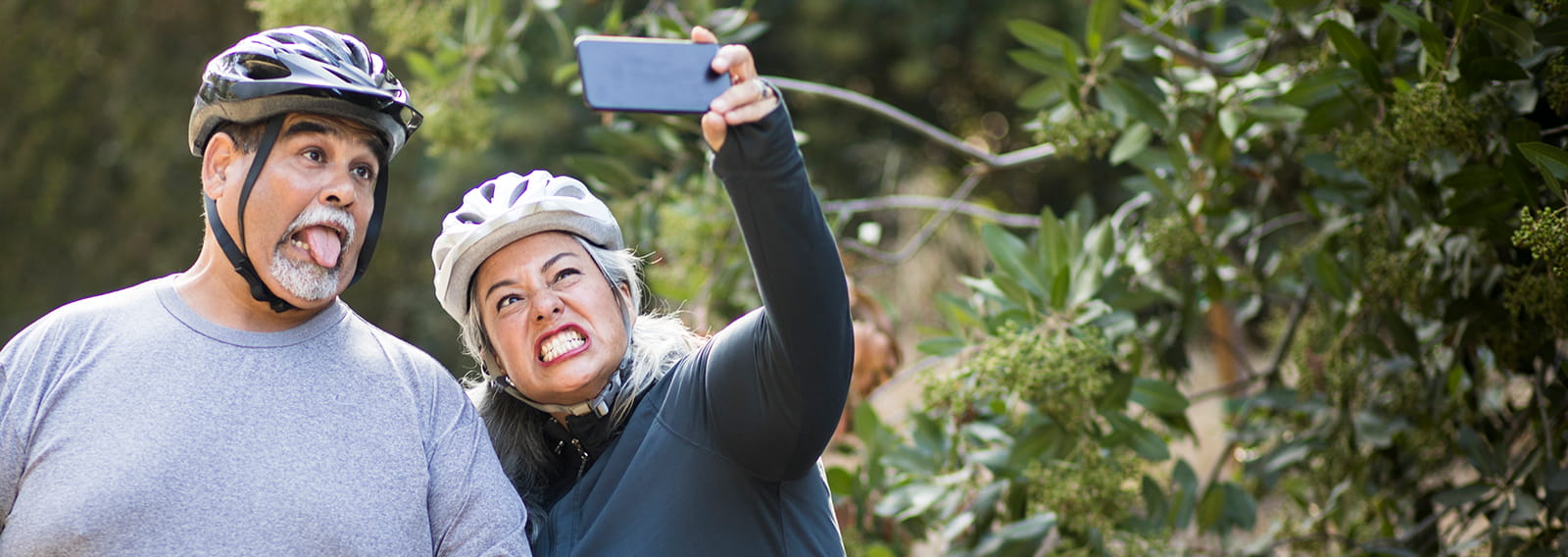Older couple excersizing and taking a goofy selfie