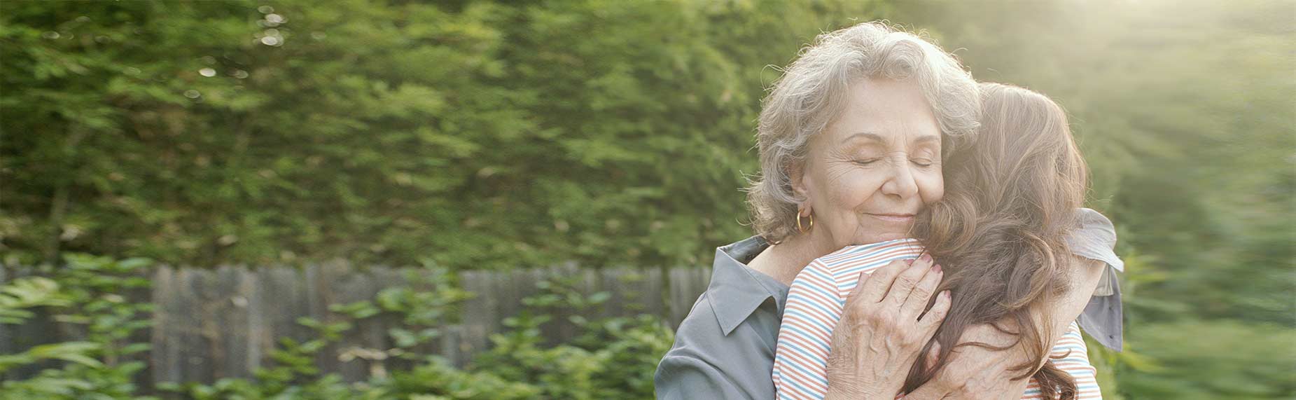Grandmother hugging granddaughter