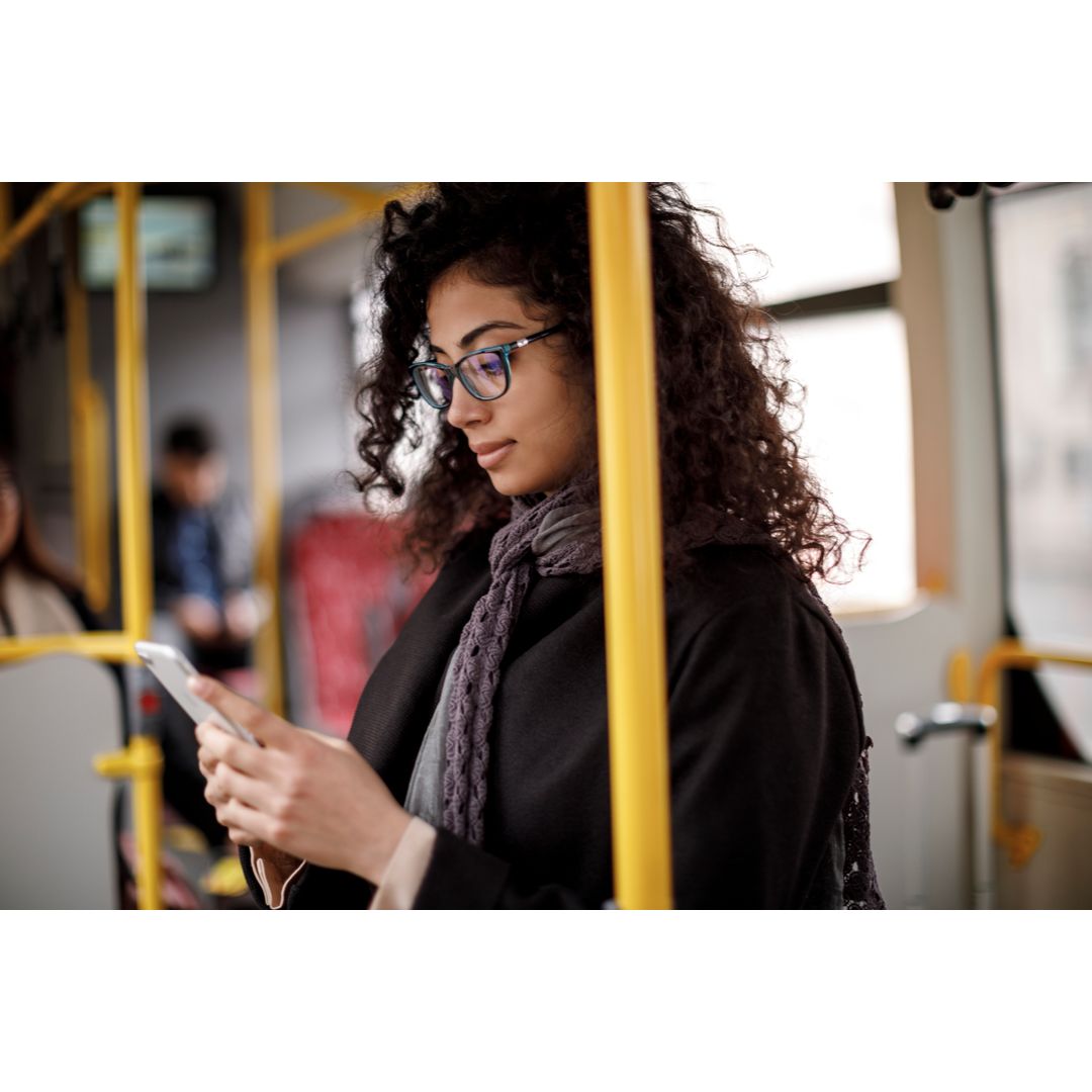 Woman on phone on a bus