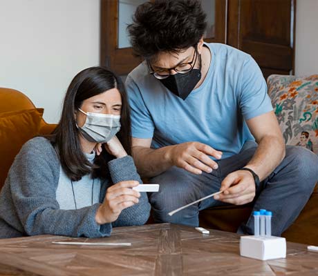 Two adults reviewing their covid 19 test results