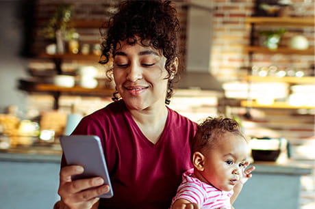 Mother working from home with baby