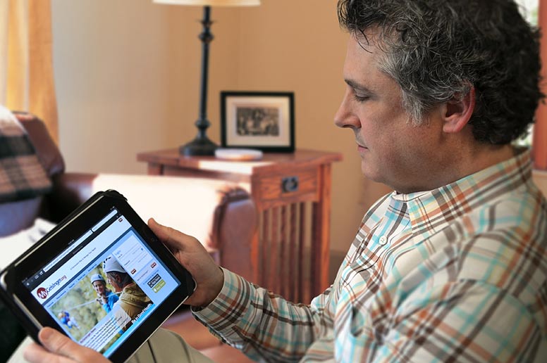 Man on tablet looking at patient portal