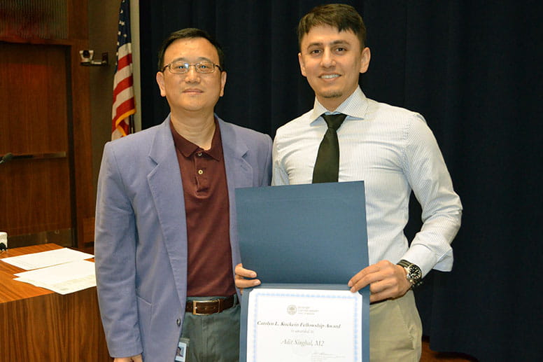 Adit Singhal (right), MD Class of 2020, with his mentor Jun Ling, PhD (left), associate professor of molecular biology.