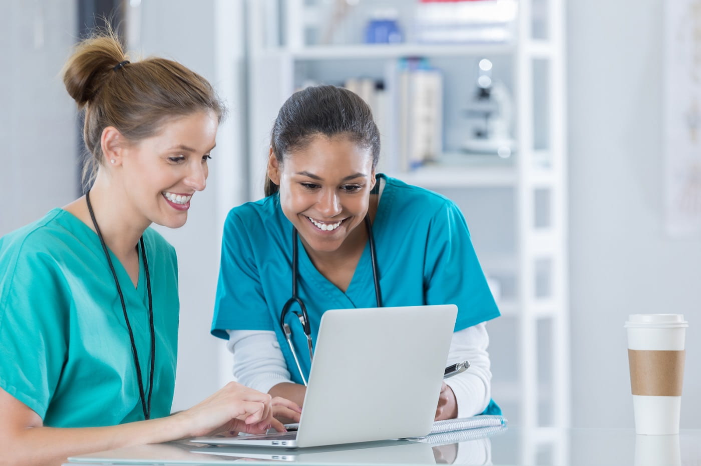 Nurses looking at laptop