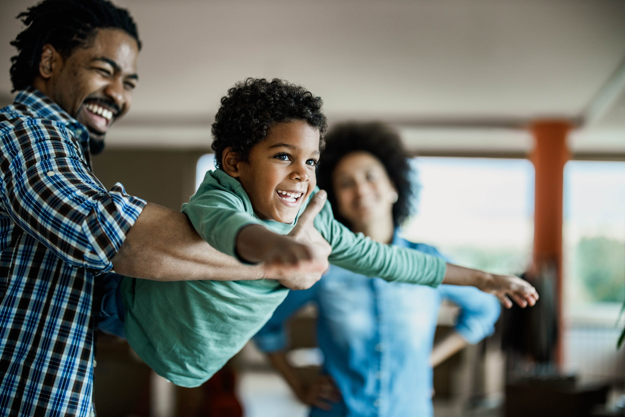 A boy playing with his family