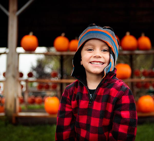 Child with pumpkins