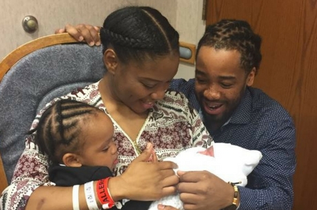 Mya Destiny Callaham with her parents and sister after being born on New Year's Day 2018.