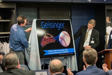 Former Yankee Andy Ashby and Dr. Anthony Aquilina unveil the Geisinger RailRiders partnership