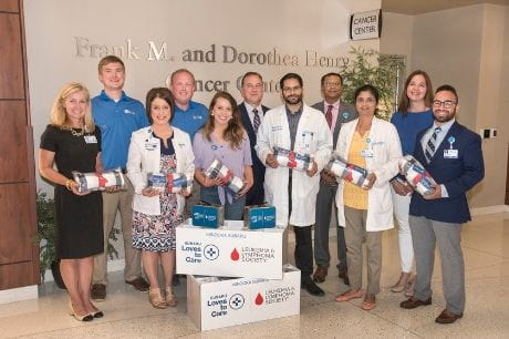 Members of Geisinger Community Medical Center prepare to deliver blankets from Subaru and the Leukemia and Lymphoma Society 
