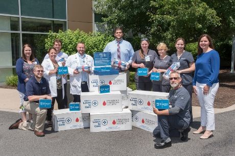 Members of Geisinger Wyoming Valley Medical Center prepare to deliver blankets from Subaru and the Leukemia and Lymphoma Society