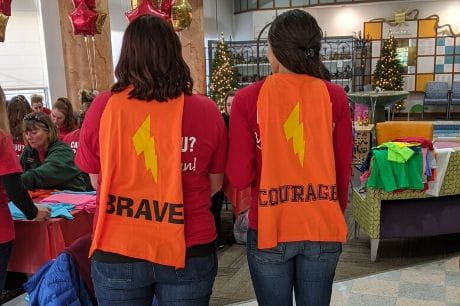 Giant employees show off the Courage Capes made at Geisinger Janet Weis Children's Hospital