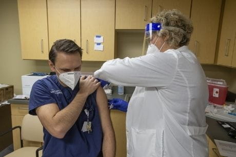 Geisinger emergency medicine physician Luke Sullivan receives the second dose of the COVID vaccine.