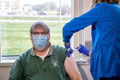 Robert Hare receives the vaccine.