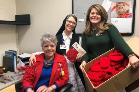 Geisinger Holy Spirit staffers with donated red hats