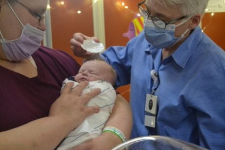 A baby is baptized in Geisinger's NICU.