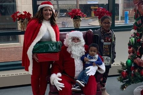 Mr. and Mrs. Claus with a family.