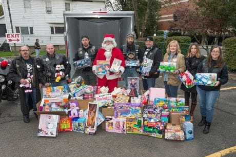 Members of the N.E. Federation of Clubs and Geisinger members accept a major toy donation for the holidays.
