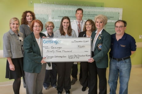 Members of the Lions Club present a check at Geisinger Wyoming Valley