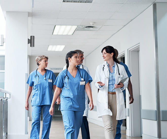 doctors walking through hospital hallway