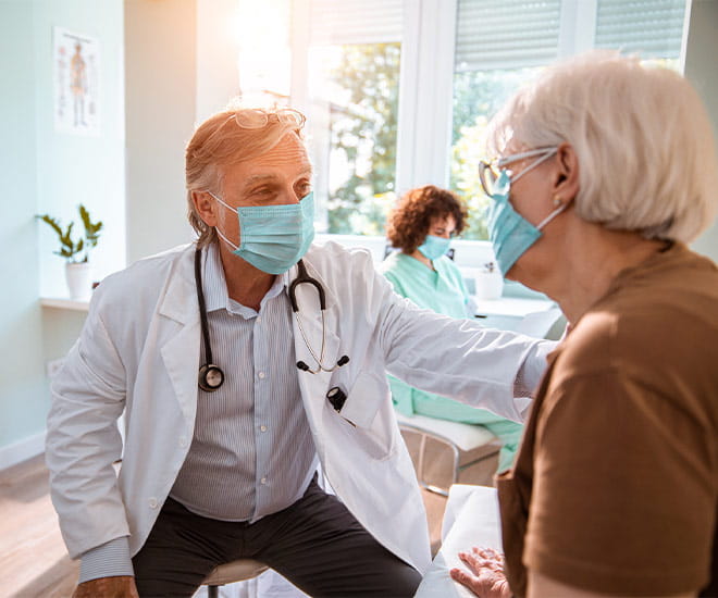 Doctor talking with patient
