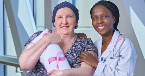Veronica Reichle with cancer surgeon Dr. Portia Siwawa