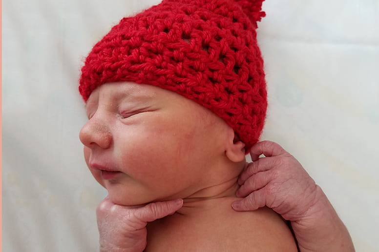 Baby in red knit hat - American Heart Association’s Little Hats, Big Hearts campaign