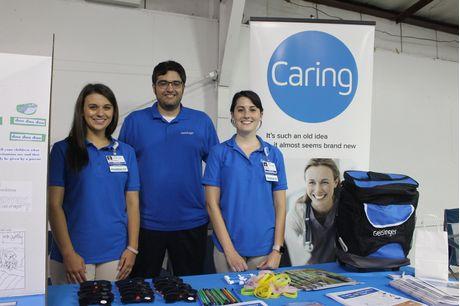 Gabby and Sierra are pictured with their supervisor, Cory Ulisse, coordinator of pharmacy services at Geisinger Lewistown Hospital. The trio volunteered their time at the Geisinger promotional booth at the Mifflin County Youth Fair this summer.