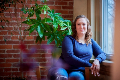 Brandy Reid, now cancer free thanks to Geisinger’s MyCode Community Health Initiative, sits near a window.