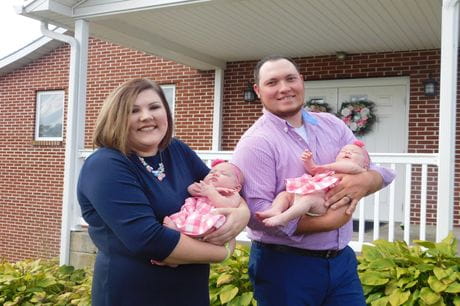 Garrett and Maddie Armstrong with their twin baby girls.