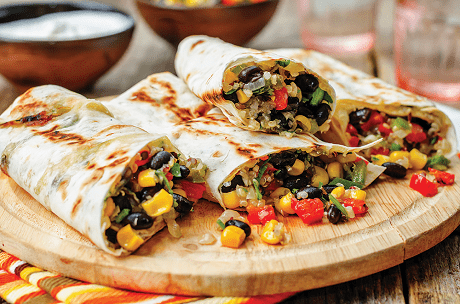 Burritos on a wooden plate
