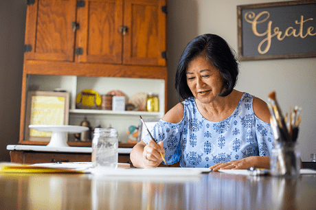 Woman painting at home