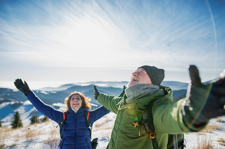 Couple outside on snow covered mountain