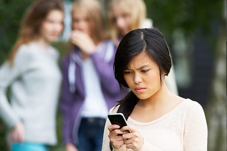 Teen looking at cell phone