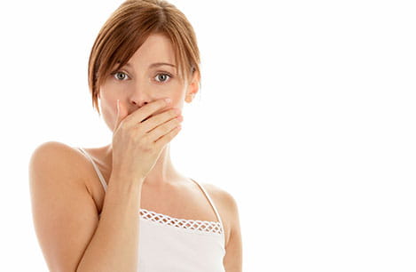 Woman hand over mouth