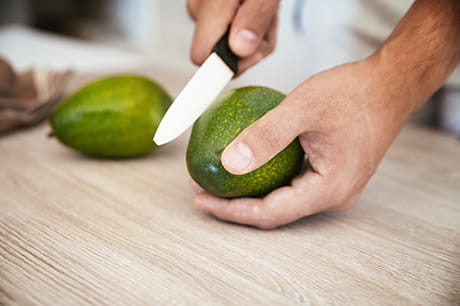 wellness avocado hand cutting safely