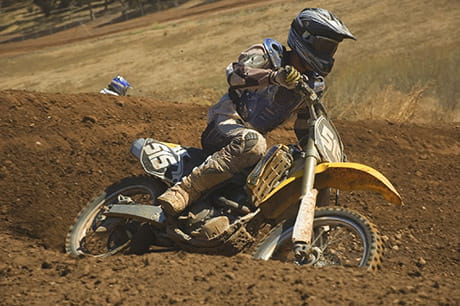 Person riding dirt bike on track