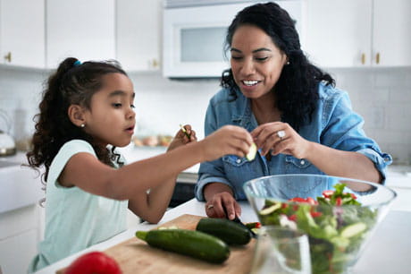 Mother and daughter making health food