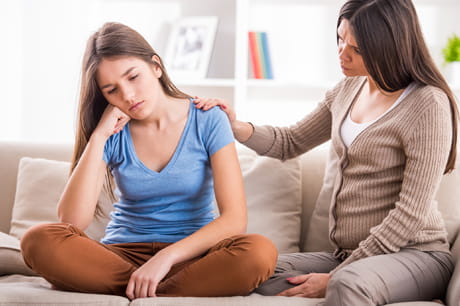 Mom consoling daughter